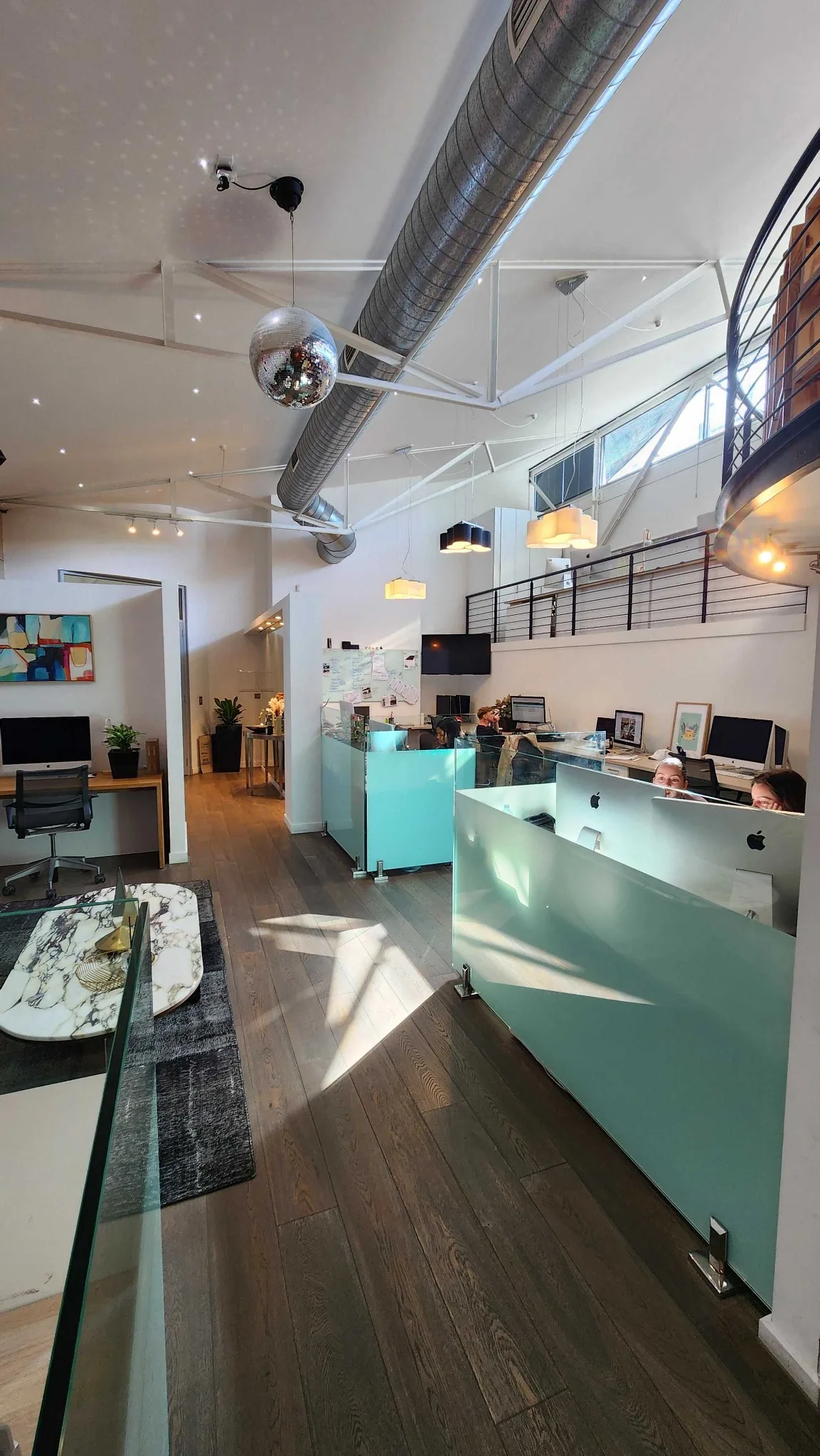 Reception desk and the stairs to the mezzanine.